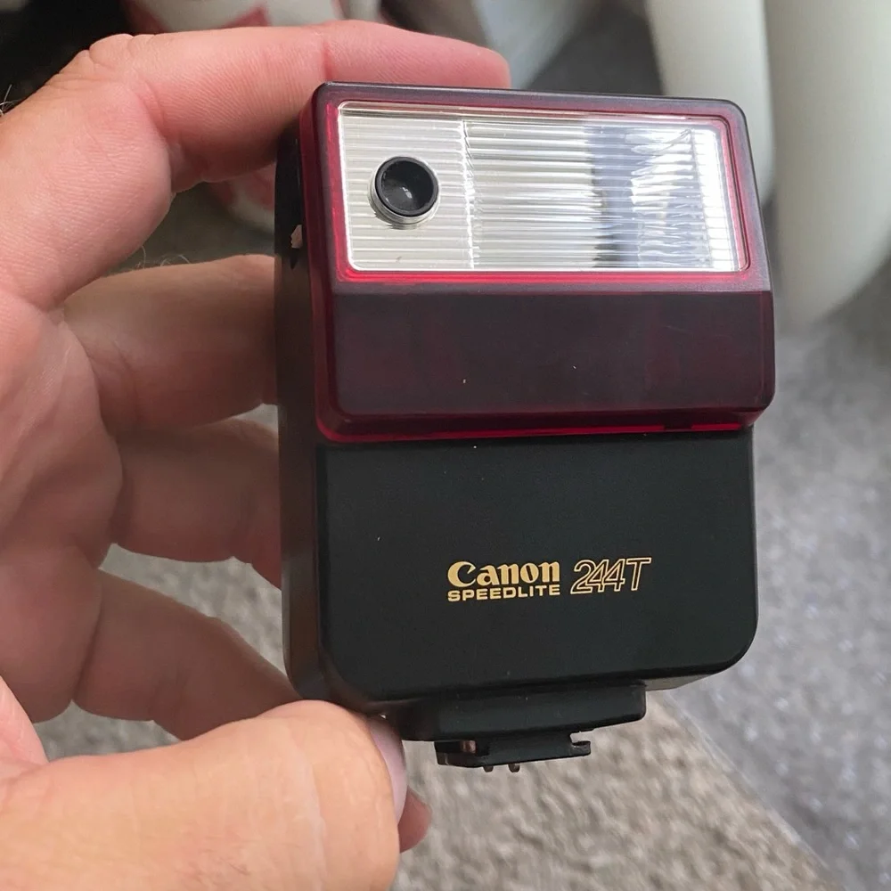 Canon Speedlite model 244T hot shoe flash for Canon Cameras.